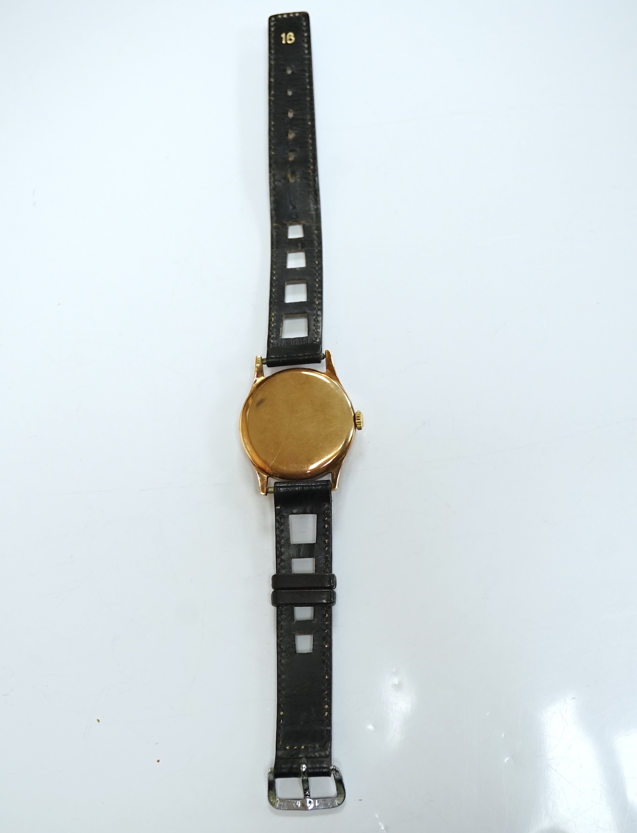 A gentleman's 9ct gold Longines manual wind wrist watch, with subsidiary seconds, case diameter 34mm, on a later associated leather strap, with Longines box. Condition - fair